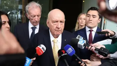 Sex Abuse Charges Against Top Aussie Media Personality Lessened